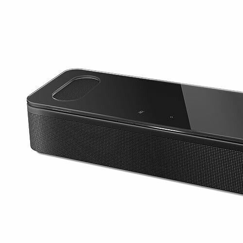 Black modern speaker with sleek design.